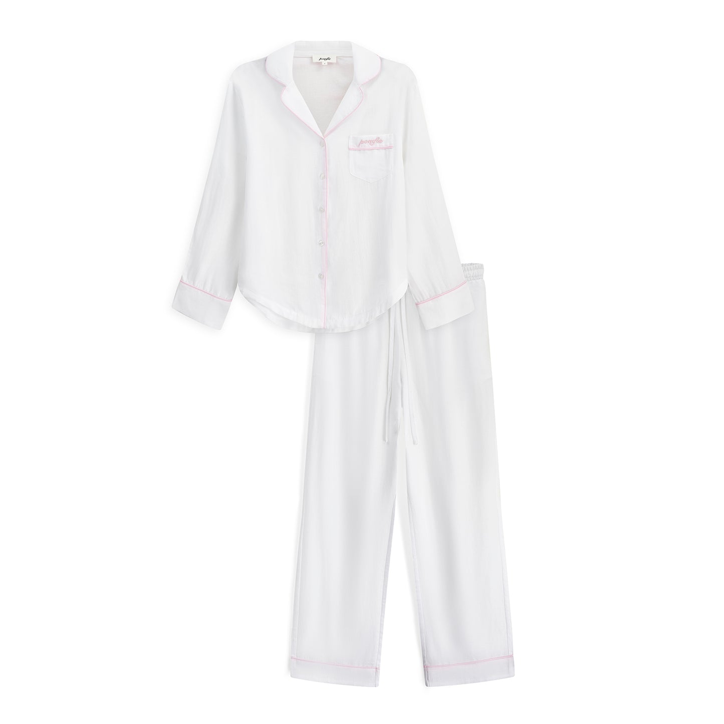 white pyjama set with baby pink piping details and pomfie logo embroidery.